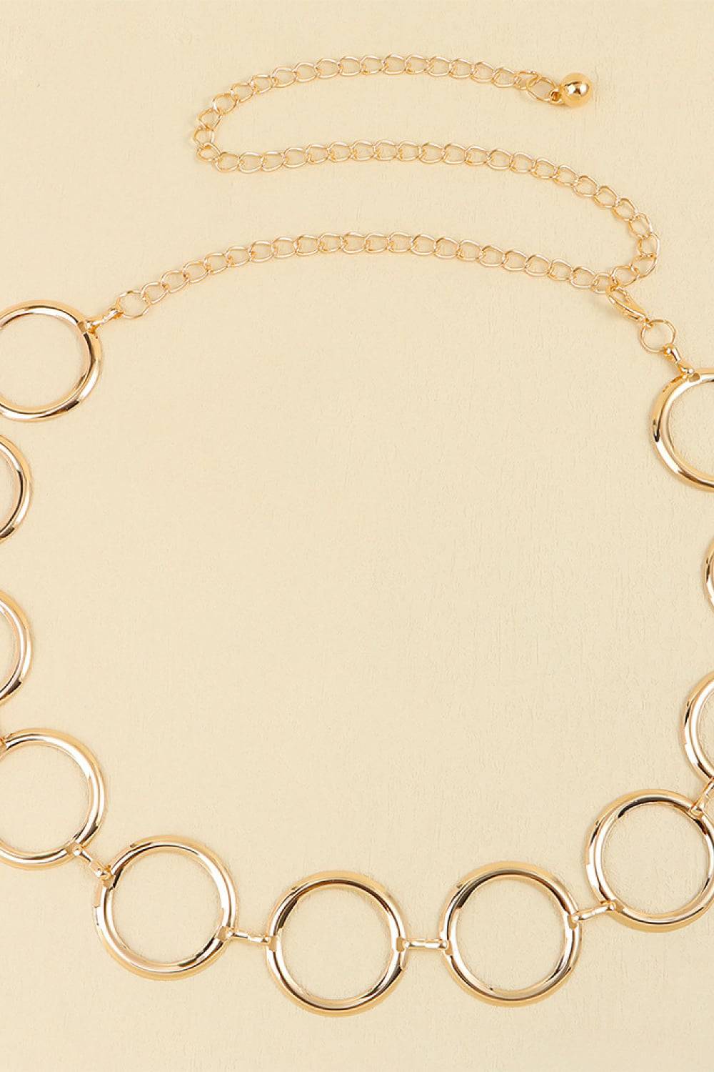 Circle ring chain belt from Trendsi featuring interlinked metal rings, stylish accessory for waist or hips.
