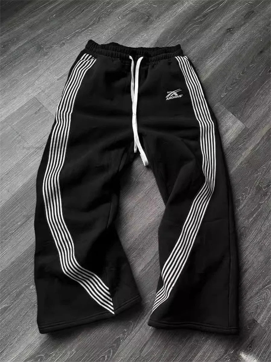 Unisex striped streetwear sweatpants with loose wide-leg fit and jogger style, crafted by Craftklart Dropship.