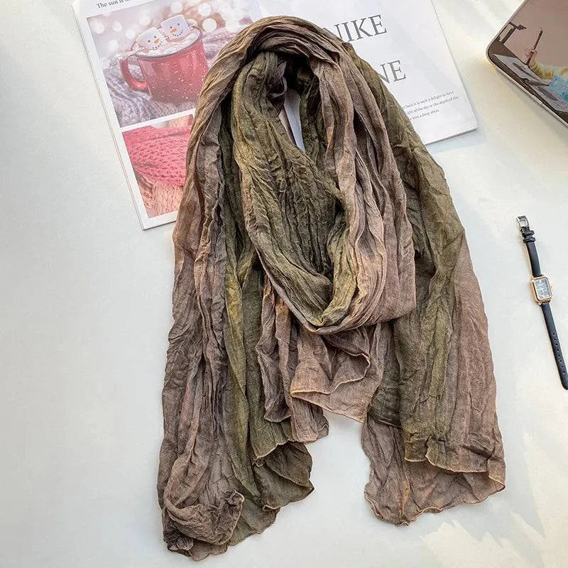 Women's tie-dye cotton and linen scarf with long folds, stylish urban accessory by Craftklart Dropship, shown in natural fabric detail.