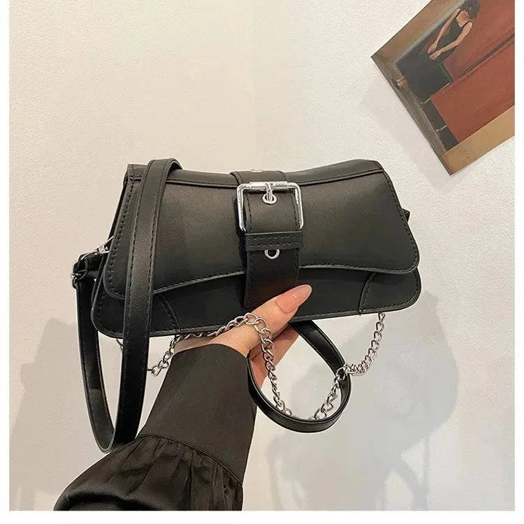 Urban styled chain link women's handbag with a sleek design, featuring a chain strap and Craftklart brand details.