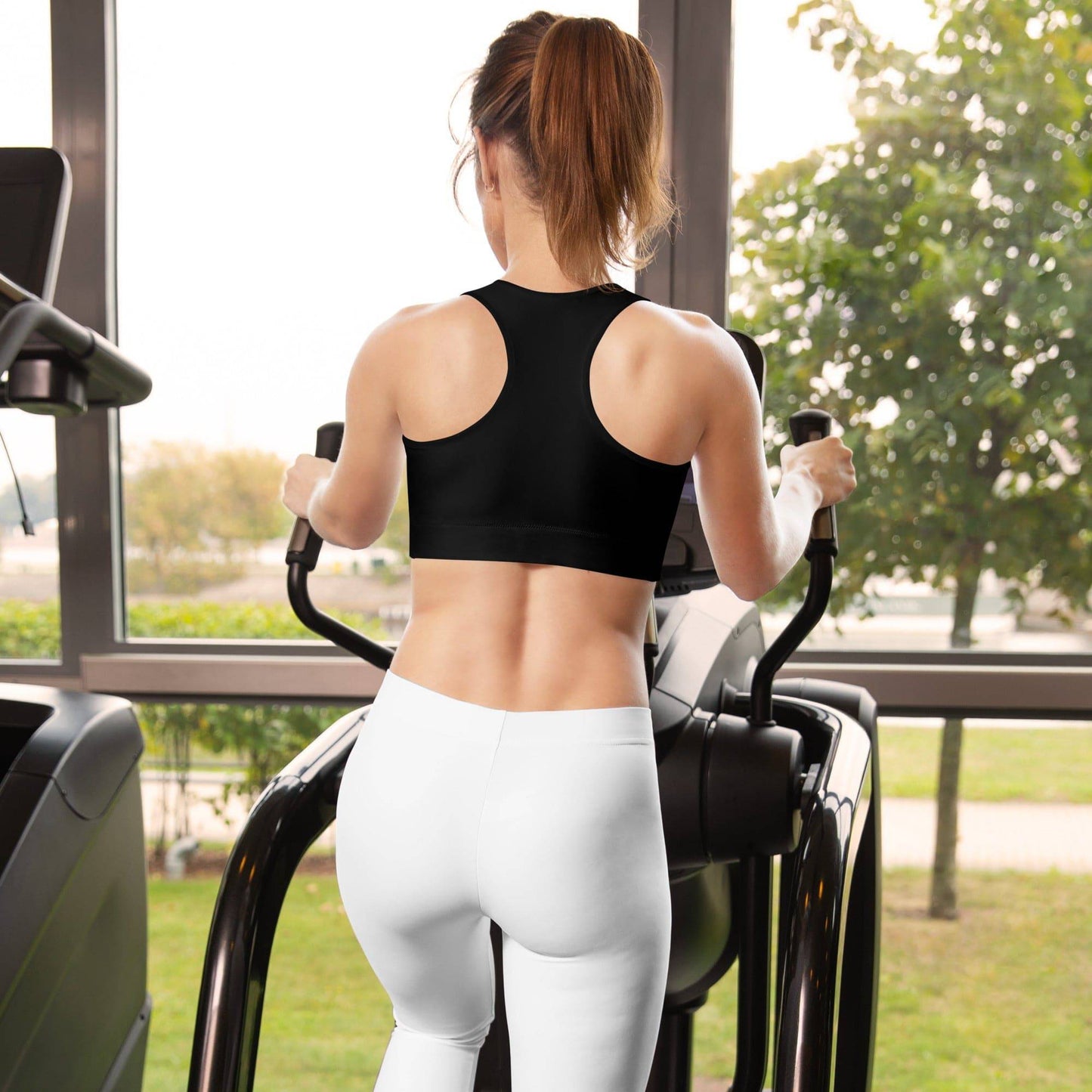 Craftklart Women's black padded sports bra with all-over print, shown from the back, designed for active wear and support.