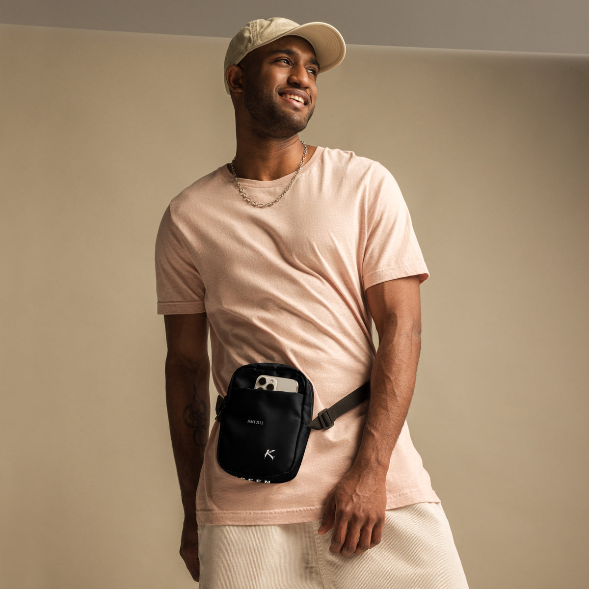 White ODMPOD Urban Form Utility Crossbody Bag with all-over print, front view showcasing adjustable strap and multiple compartments.