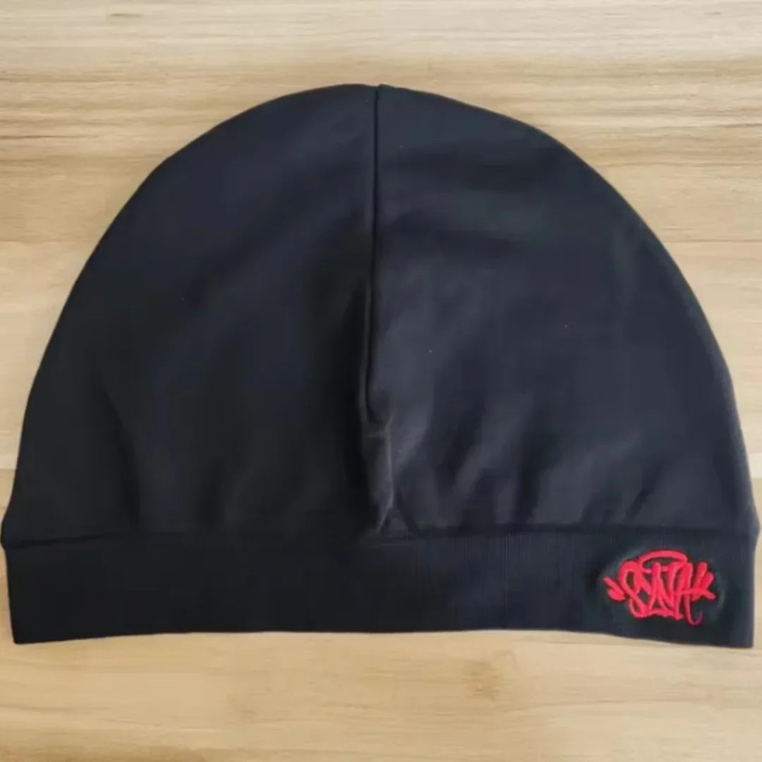 Black Fabric Sy-na styled beanie hat by Craftklart Dropship, featuring a snug fit and soft knit material for everyday wear.