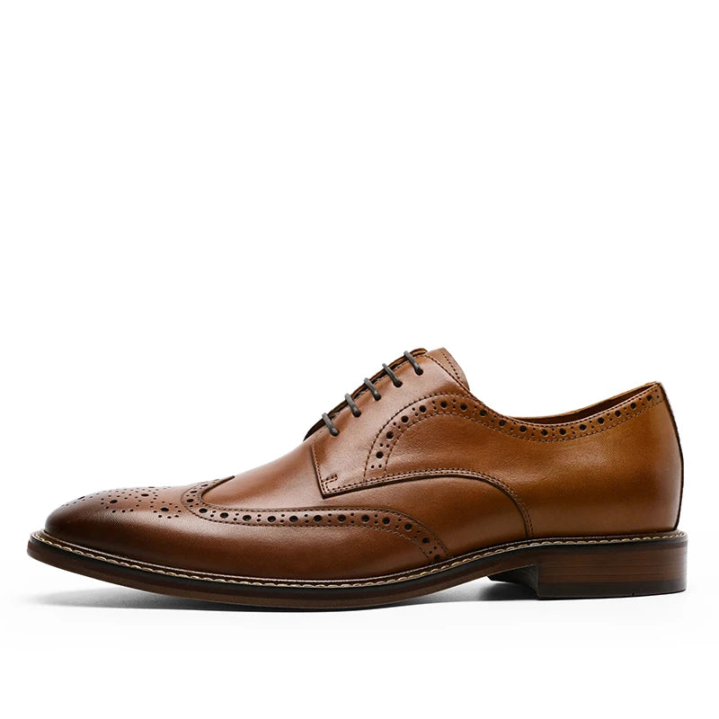 Men's black genuine leather carved brogue dress shoes with detailed perforations and classic lace-up design.
