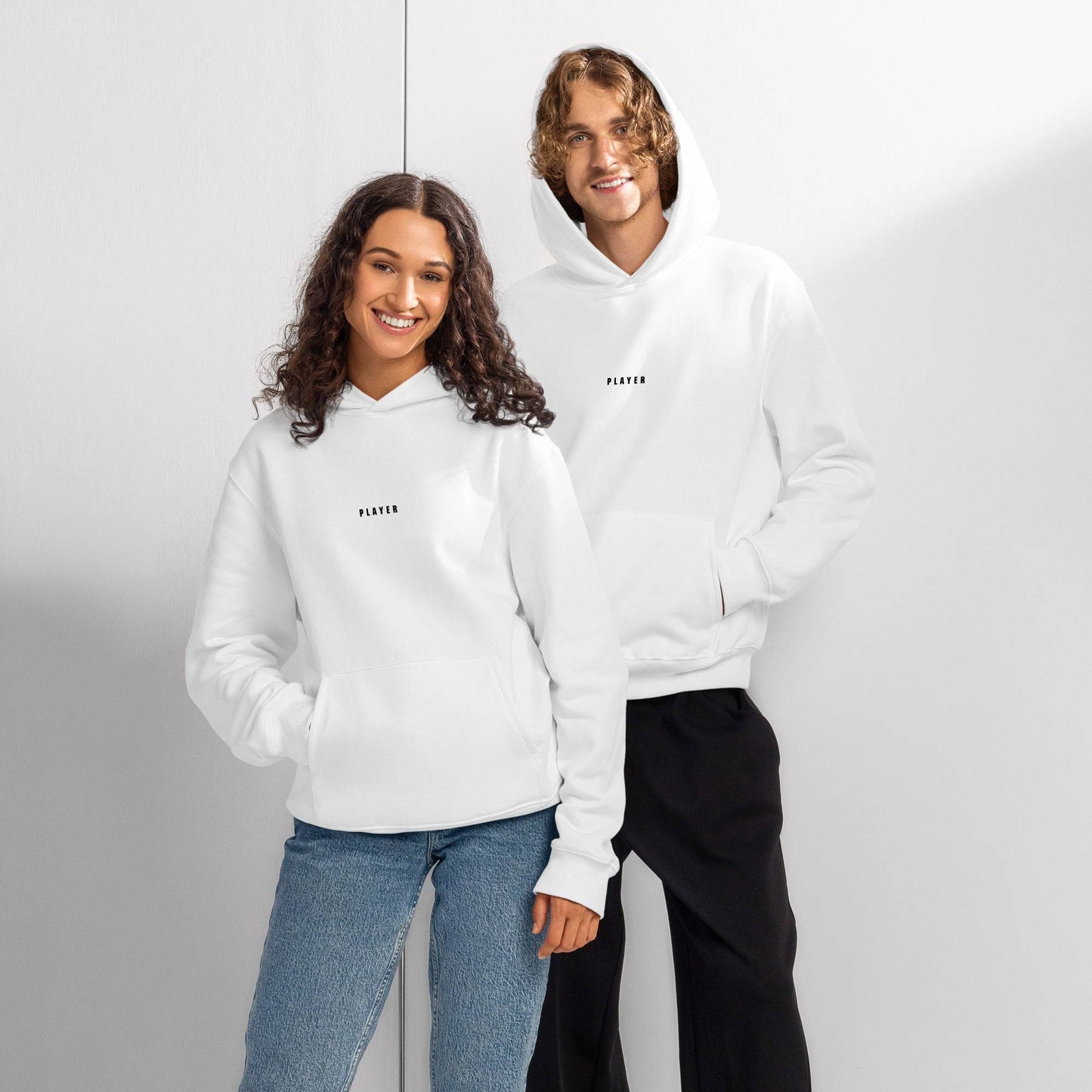 White unisex oversized heavyweight hoodie with front pocket and hood, perfect for casual wear by Craftklart.store.