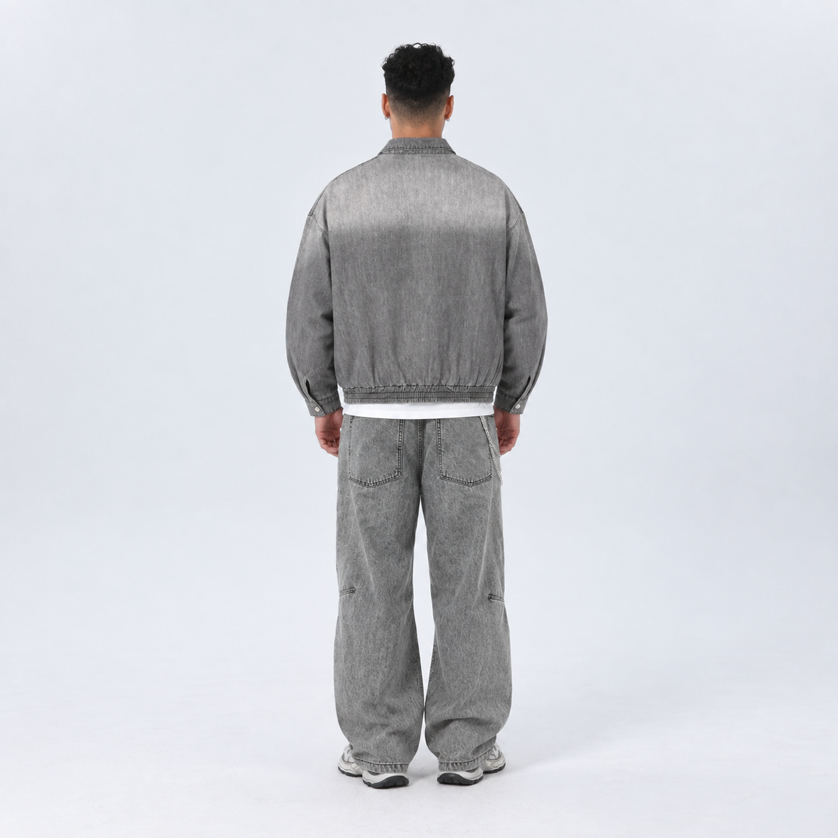 Back view of a man wearing the Urban Fashion & Streetwear | Craftklart light grey washed denim zip jacket.