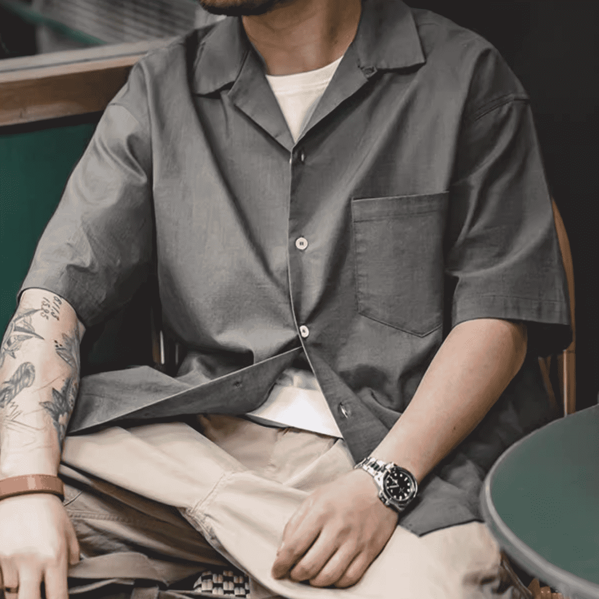 Urban Fashion & Streetwear Cuban collar short-sleeve shirt displayed on a hanger with a vibrant pattern and relaxed fit.