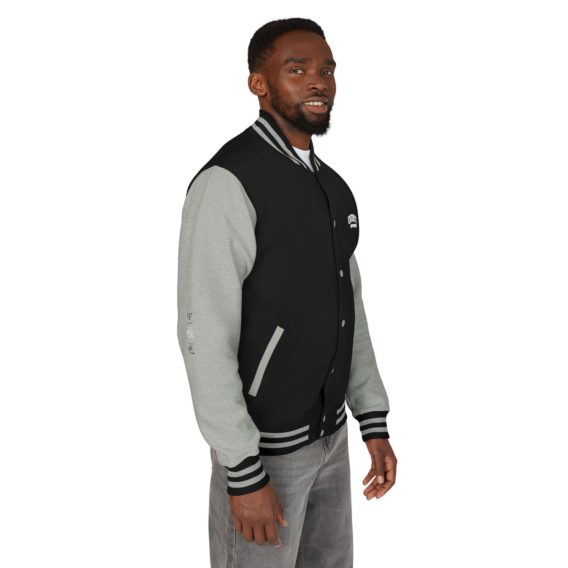 Craftklart UK Underground varsity jacket by Printify featuring retro letterman style and streetwear design, displayed on a hanger.