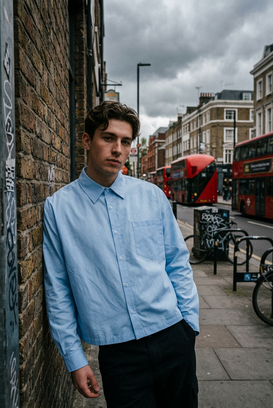 Plain ODMPOD boxy long sleeve shirt in neutral fabric, featuring a relaxed fit and classic round neckline.