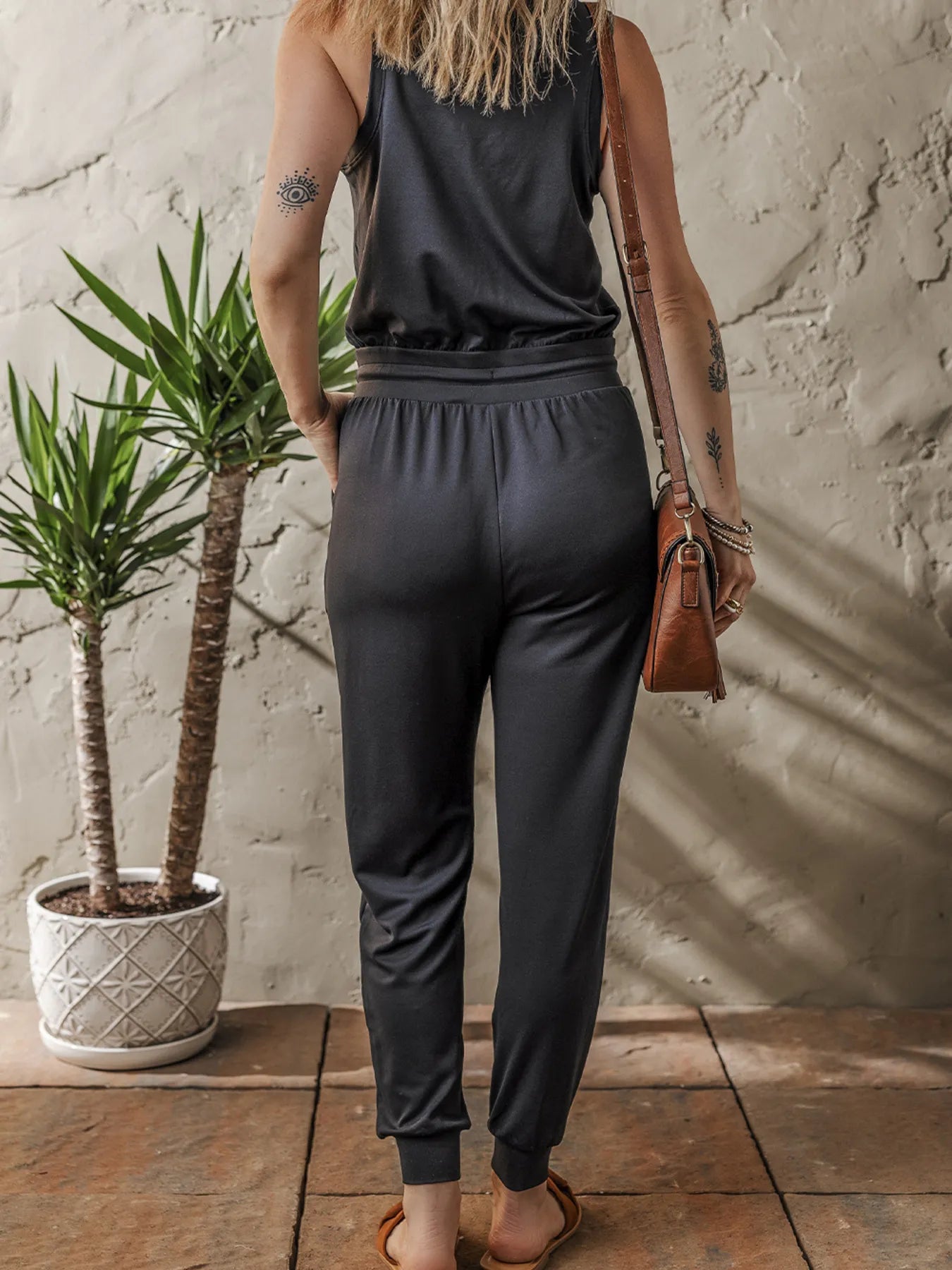 Tie Waist Sleeveless Jogger Jumpsuit - Premium Jumpsuit from Trendsi - Just $35.08! Shop now at Craftklart.store