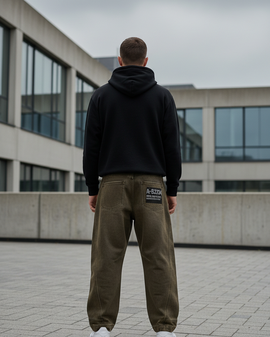 Back view of Urban Fashion & Streetwear's Street Washed Curved Loose-Fit Jeans, showcasing relaxed fit and washed denim texture.