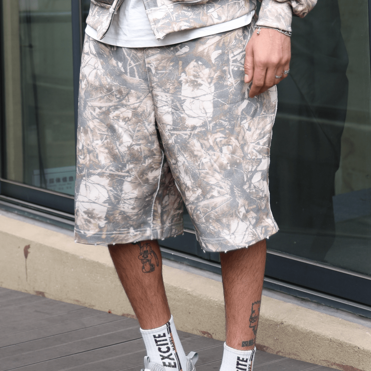 French Terry Camo Shorts from Urban Fashion & Streetwear, featuring a green camouflage pattern and a relaxed fit.