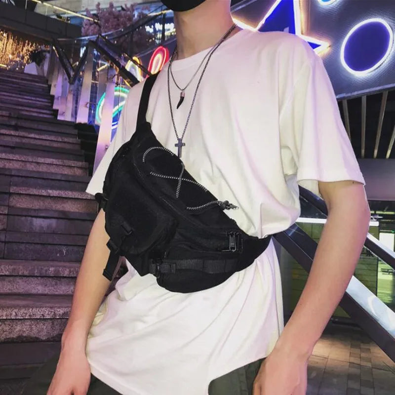 Unisex tactical crossbody chest bag in black with adjustable strap, urban style, designed for convenient streetwear carrying.