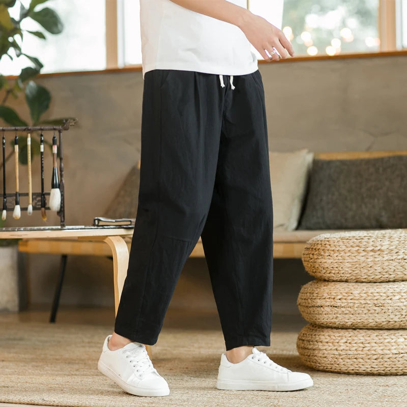 Craftklart men's loose fit drawstring trousers with casual streetwear style, shown in a relaxed fit on a model.
