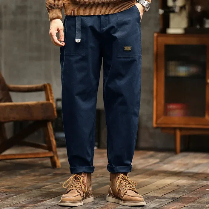 Craftklart men's cargo trousers with a loose fit, utility streetwear style, featuring multiple pockets and durable fabric.