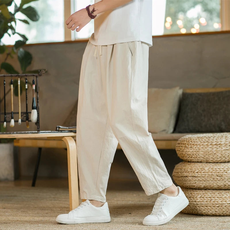 Craftklart men's loose fit streetwear trousers with drawstring waist and relaxed style, shown in black fabric.