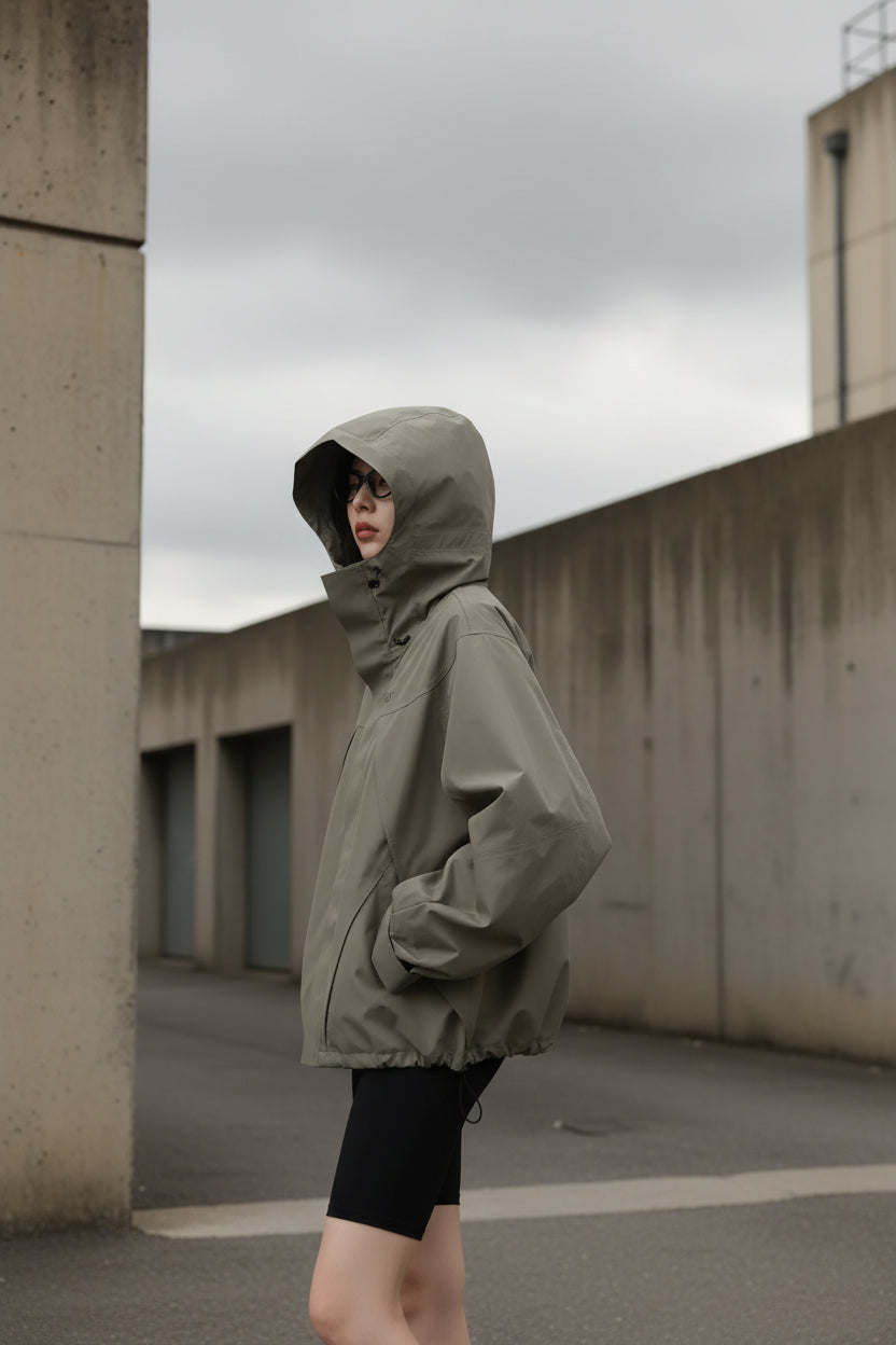 Women’s hooded windproof jacket by Craftklart, oversized streetwear coat with a hood, designed for wind resistance and style.