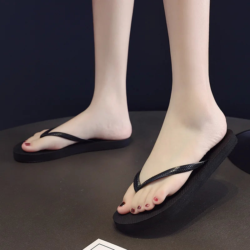 Women's herringbone flip flop sandals by Craftklart Dropship, lightweight beach slides in five colors, shown on sandy surface.
