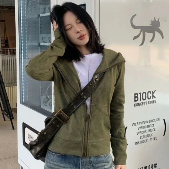 Craftklart oversized sage green zip-up hoodie displayed on a hanger, showcasing its relaxed fit and soft fabric texture.