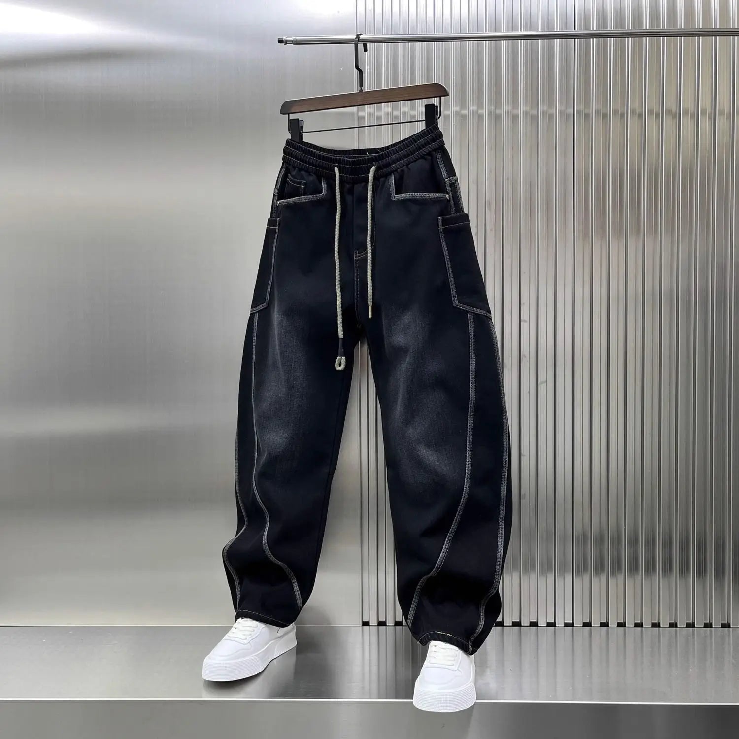 Craftklart men's wide-leg denim jeans with elastic waist, streetwear style, shown in a relaxed fit with classic blue denim fabric.