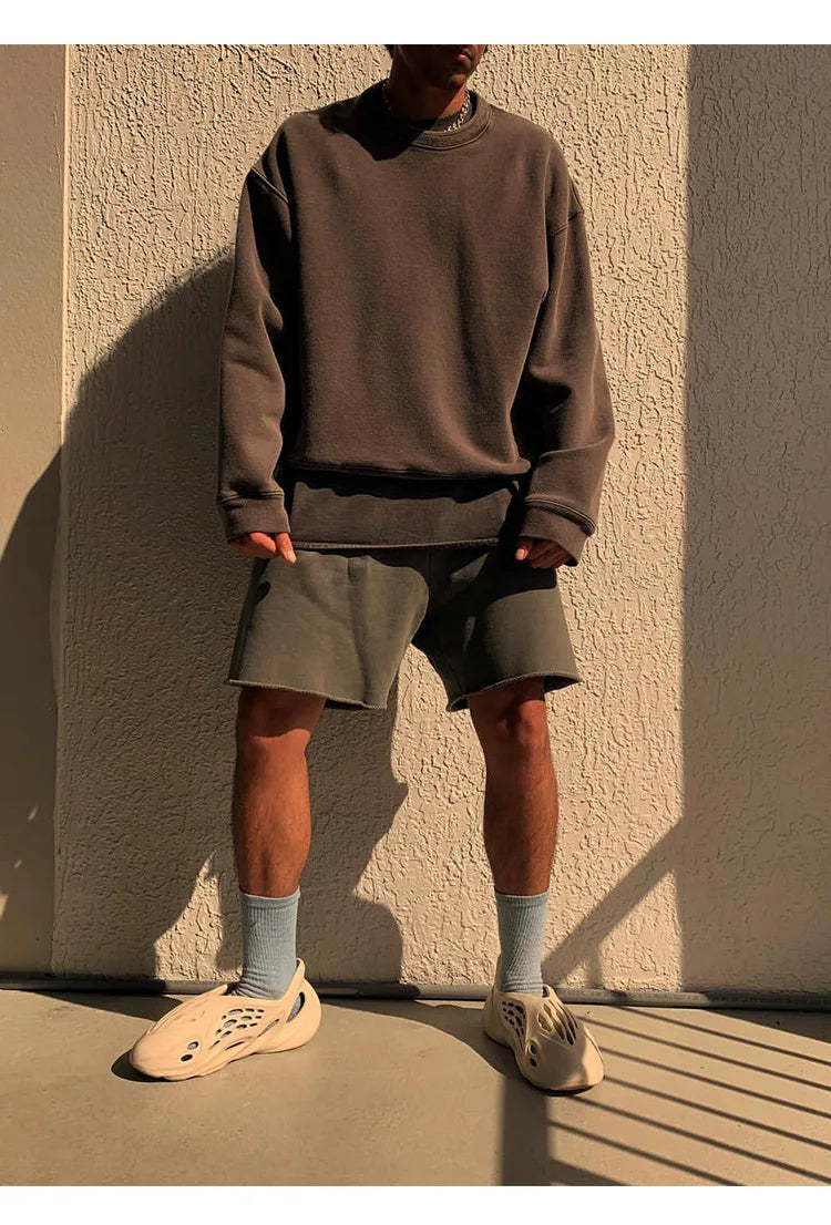 Craftklart men's cotton drawstring shorts with a loose fit, ideal for streetwear, shown in a casual outdoor setting.