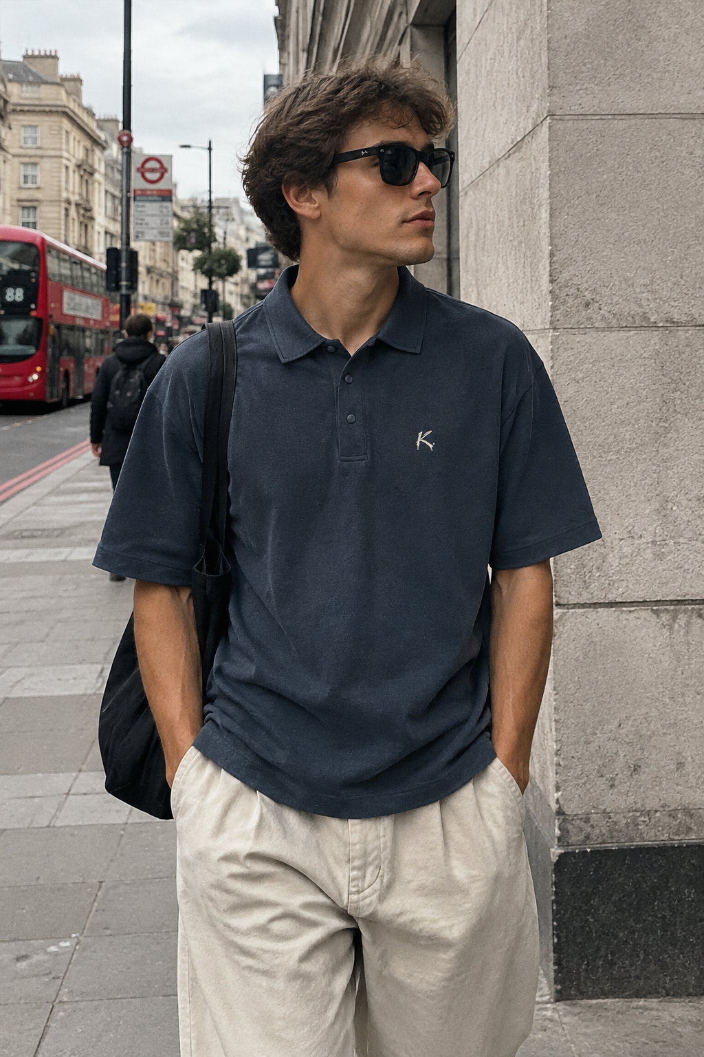 ODMPOD 250GSM drop shoulder polo shirt in a neutral color, featuring a relaxed fit and classic collar style.