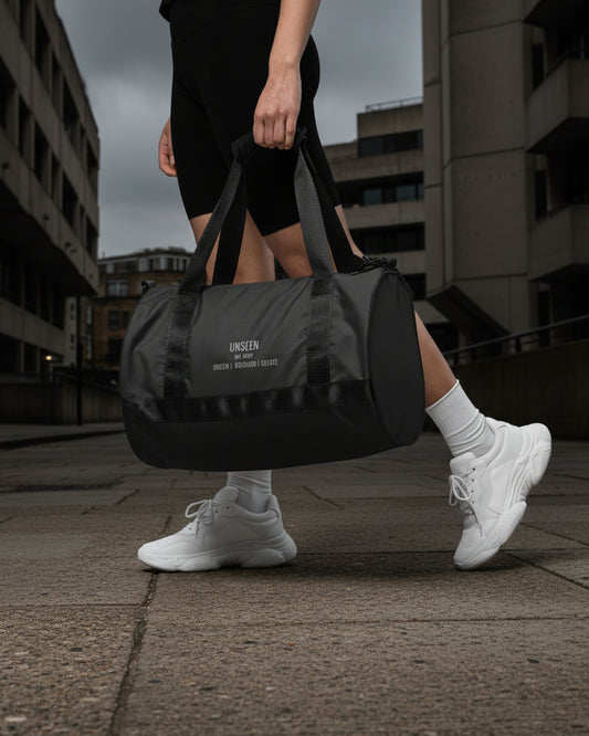 Craftklart Gym Holdhall all-over-print gym bag with white background, featuring the brand's logo and spacious design for fitness gear.