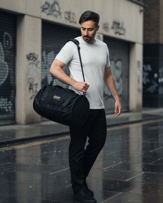 Craftklart Quiet Authority gym bag with all-over white print, featuring sturdy handles and spacious design for workout gear.