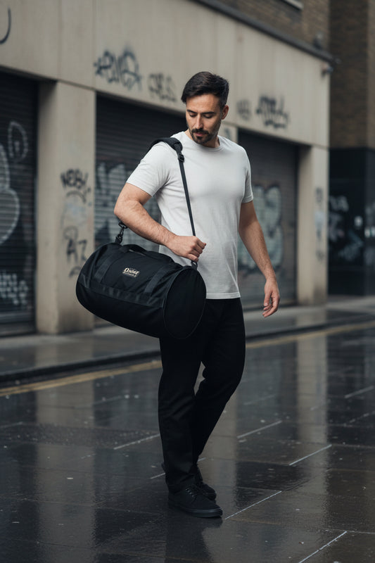 Craftklart Quiet Authority gym bag with all-over white print, featuring sturdy handles and spacious design for workout gear.