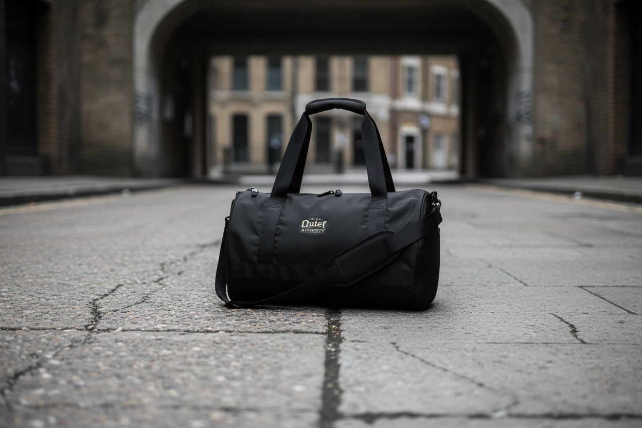 Craftklart Quiet Authority gym bag with all-over white print, showing the right front view of the versatile sports bag.