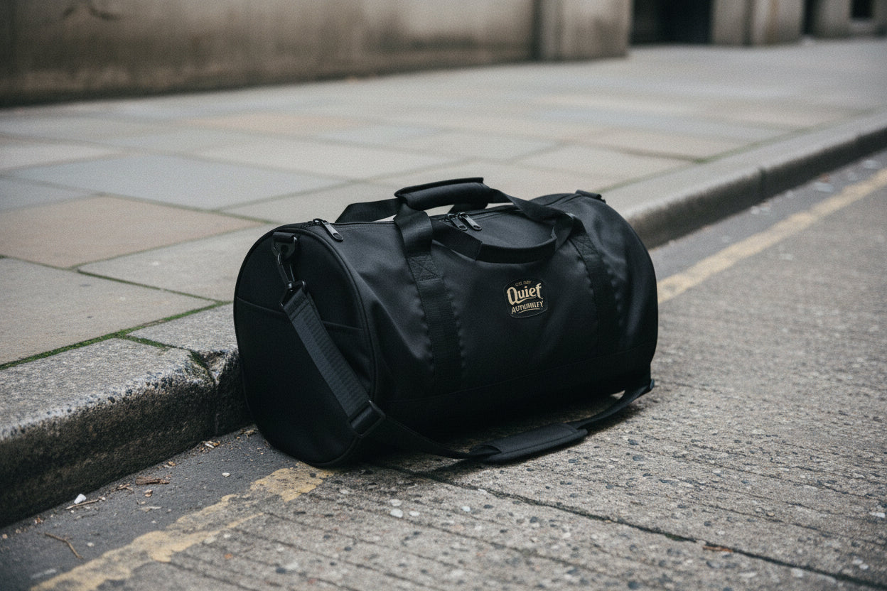 Craftklart Quiet Authority gym bag with all-over white print, showing the right front view of the stylish, spacious bag.