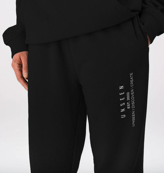 CKL Unseen Jogger made from organic cotton fleece, featuring a relaxed fit and streetwear style, shown in dark grey fabric.