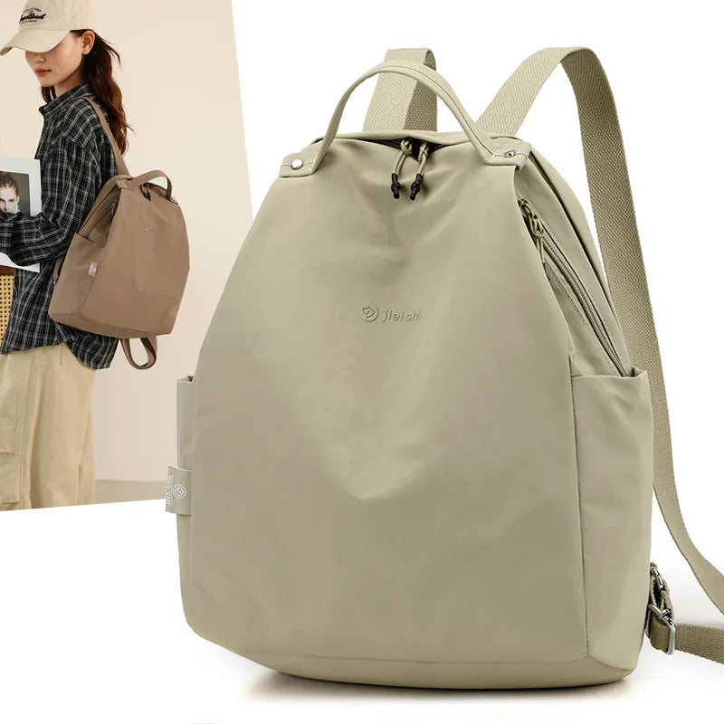 Lightweight nylon backpack by Craftklart Dropship with large capacity for travel and school, featuring multiple compartments for storage.