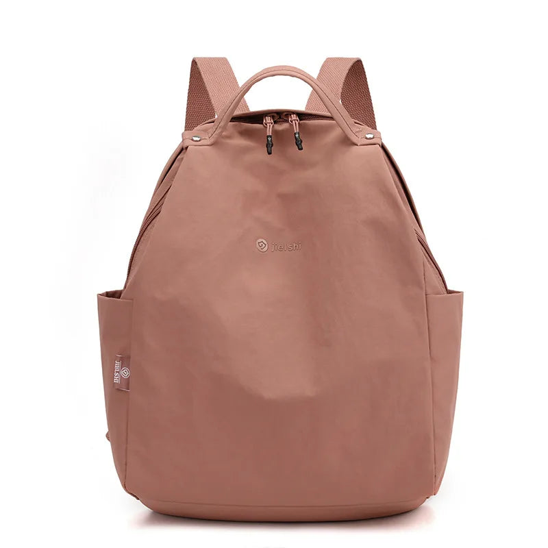 Lightweight nylon backpack by Craftklart Dropship with large capacity, ideal for travel and school, unisex design, shown with multiple compartments.