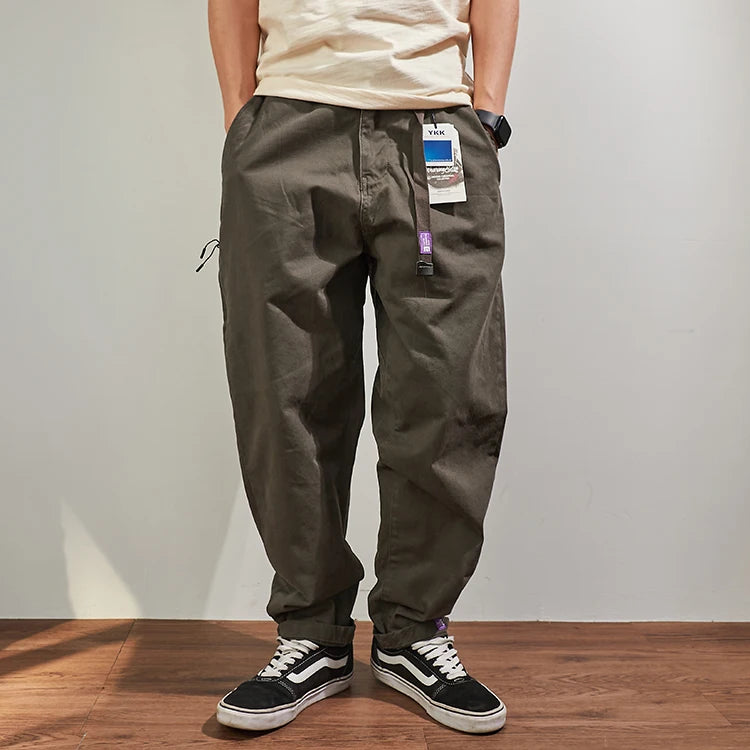 Gray men's baggy tapered cotton cargo streetwear pants by Craftklart Dropship, featuring multiple pockets and relaxed fit.