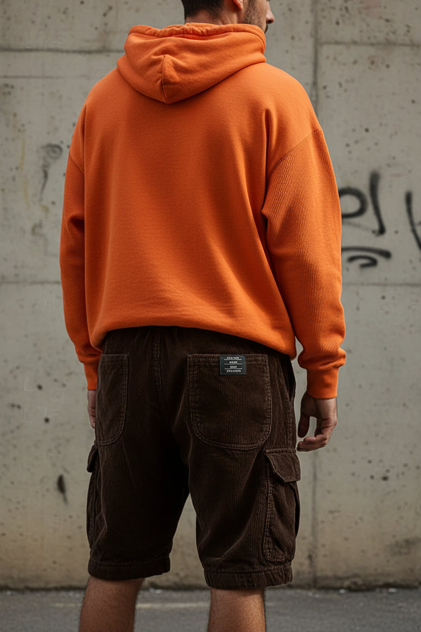 Men's loose casual textured corduroy cargo shorts in solid coffee color, featuring a relaxed fit and practical pocket design.