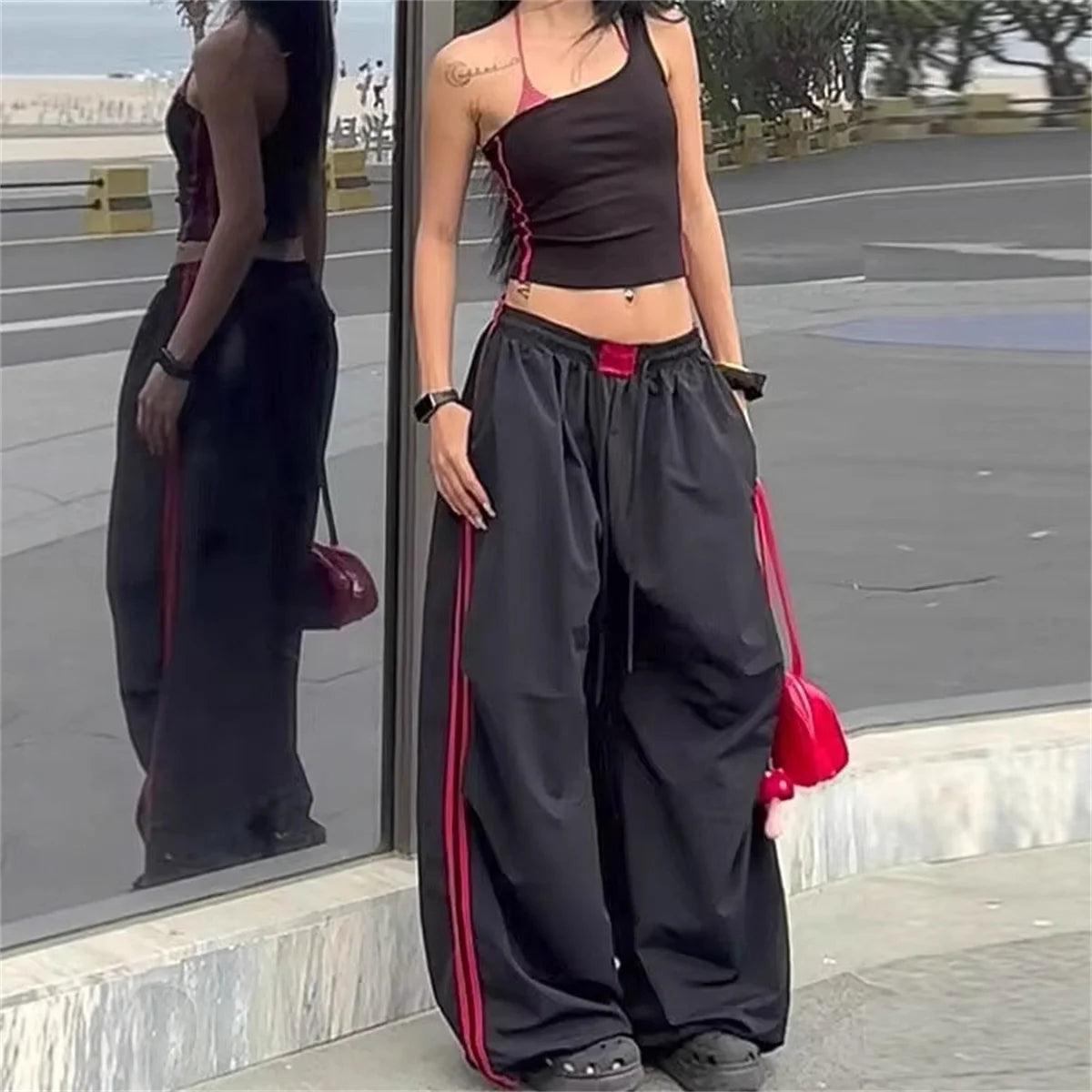 Red women's wide-leg cargo joggers by Craftklart Dropship, featuring baggy streetwear style with comfy sweatpants fit.