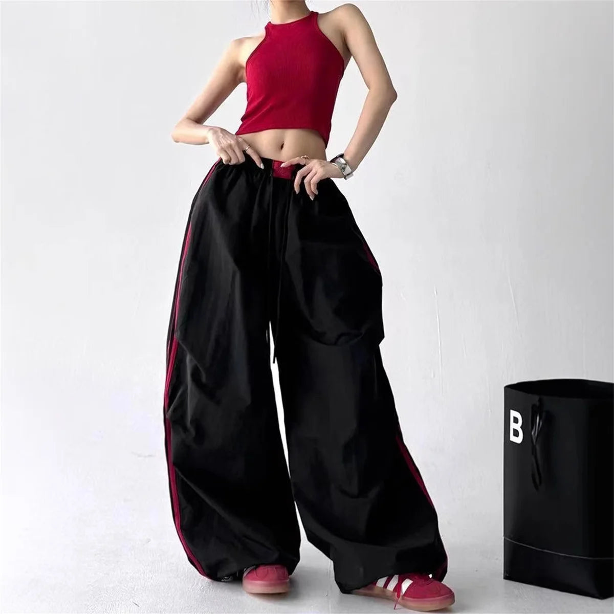 Red women's wide-leg cargo joggers by Craftklart Dropship with baggy streetwear style and comfortable sweatpant fit.