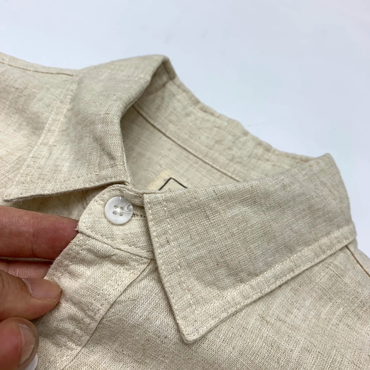 Black American Retro cotton linen men's shirt with relaxed fit and lapel collar, featuring a casual, stylish design.