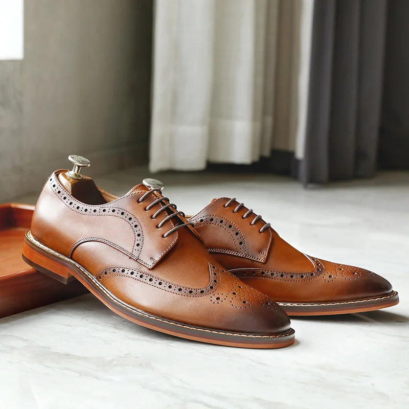 Men's black genuine leather carved brogue dress shoes with intricate perforated detailing, crafted by Craftklart Dropship.