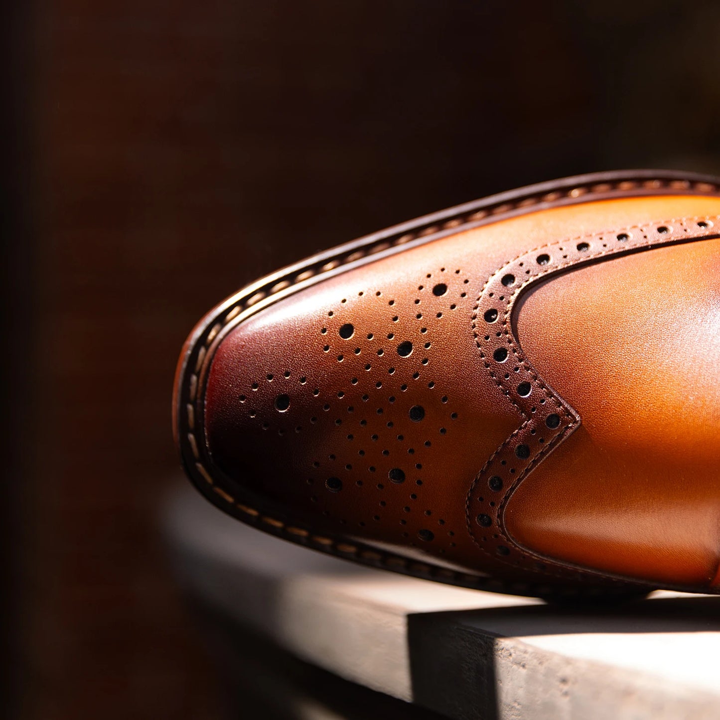 Men's genuine leather carved brogue dress shoes in black with detailed perforations and classic lace-up design.