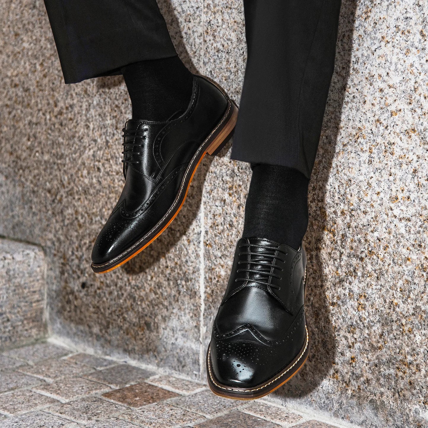 Men's genuine leather carved brogue dress shoes in black with detailed perforations and classic lace-up design.
