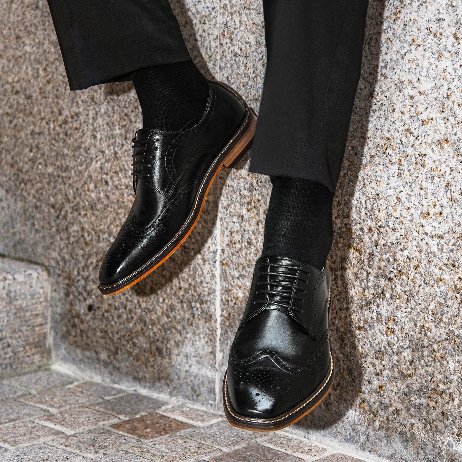 Men's genuine leather carved brogue dress shoes in black with detailed perforations and classic lace-up design.