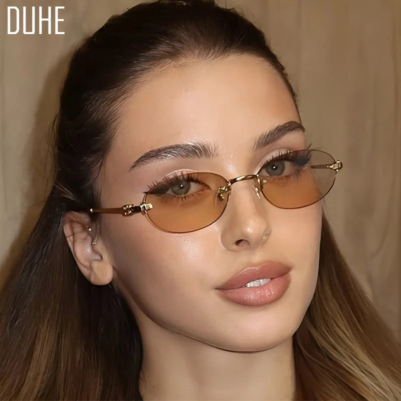 Women's summer frameless oval sunglasses with pink and gold frames, UV400 protection, stylish and lightweight for sunny days.
