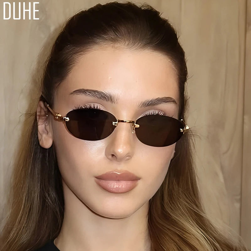 Women's summer frameless oval sunglasses with gold and pink accents, UV400 protection, stylish and lightweight eyewear by Craftklart Dropship.