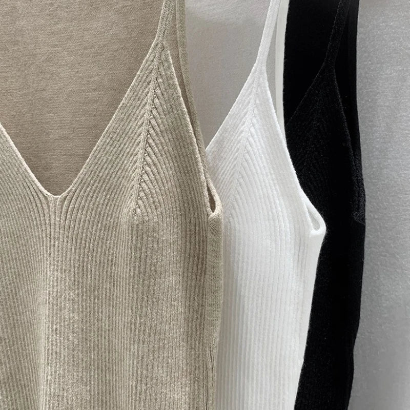 Black women's slim fit V-neck knit tank top, sleeveless cami vest designed by Craftklart Dropship, styled on a model.