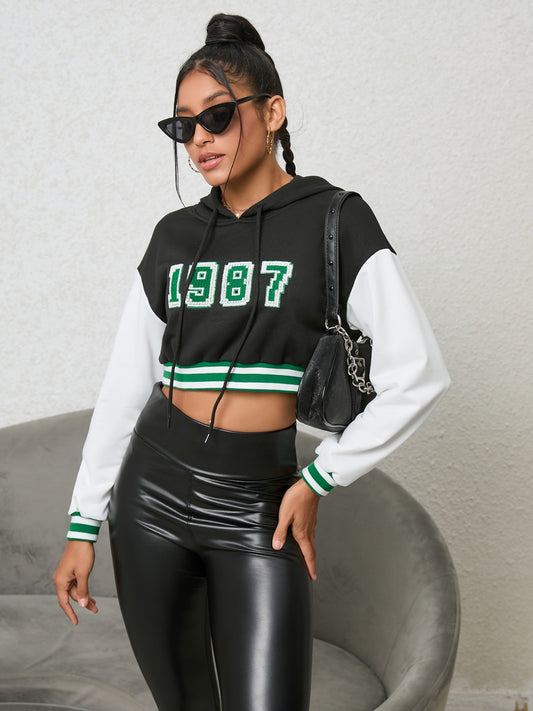 1987 Graphic Cropped Hoodie - Premium Hoodie from Trendsi - Just $24.32! Shop now at Craftklart.store