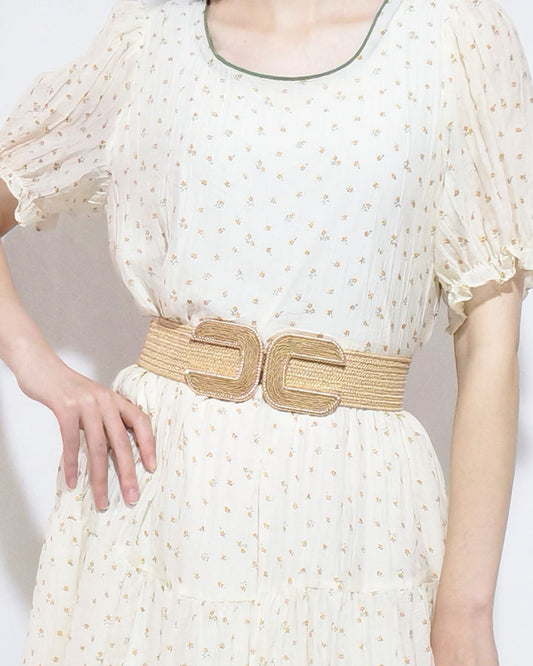 Wide braid belt by Trendsi, featuring a stylish woven design, shown in a close-up image highlighting the textured fabric and buckle detail.