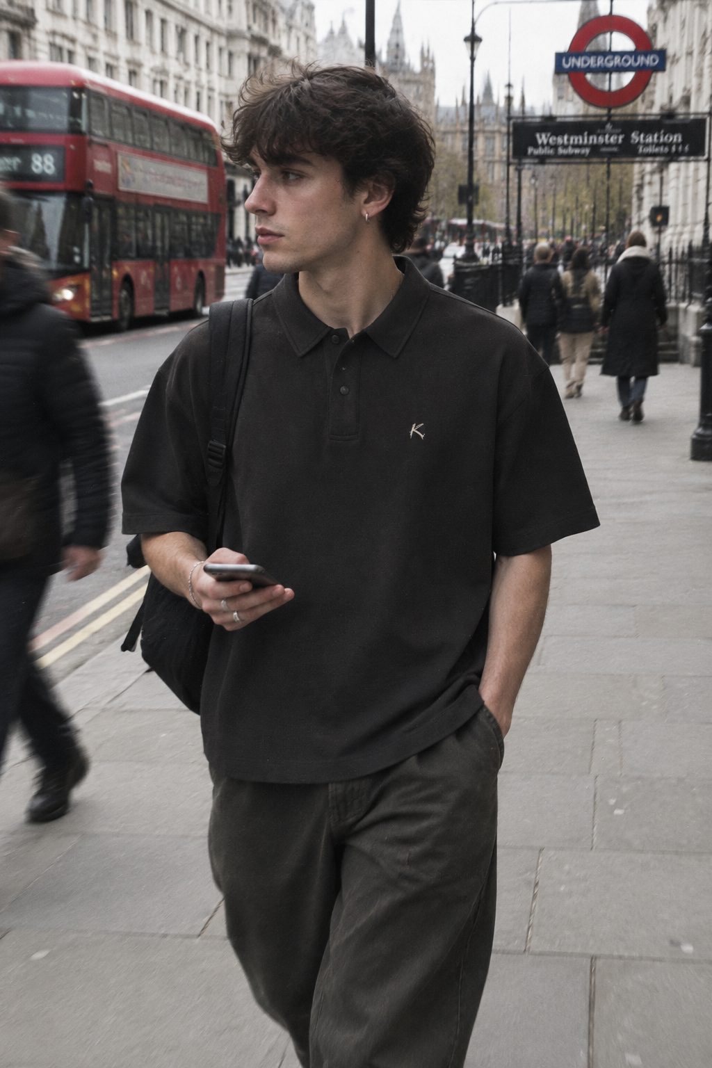 ODMPOD 250GSM drop shoulder polo shirt, light fabric with a relaxed fit, displayed on a hanger showing the collar and dropped sleeves.
