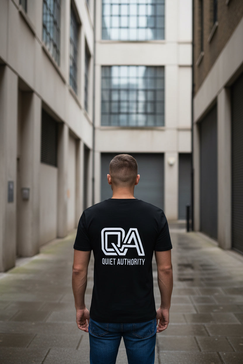 Black Craftklart organic cotton unisex T-shirt with a back design, streetwear essential made from sustainable materials.